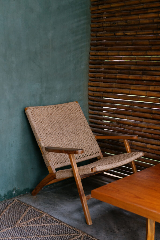 Hotel room at Samas La Saladita with a view of the private ensuite bathroom, featuring sliding wood doors and modern design.